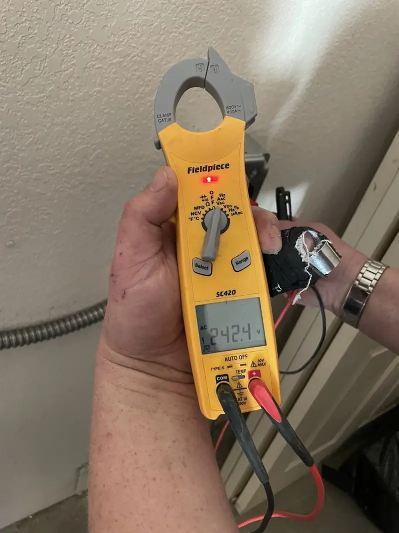Voltage testing with clamp meter during Whole House Surge Protector in Jackson